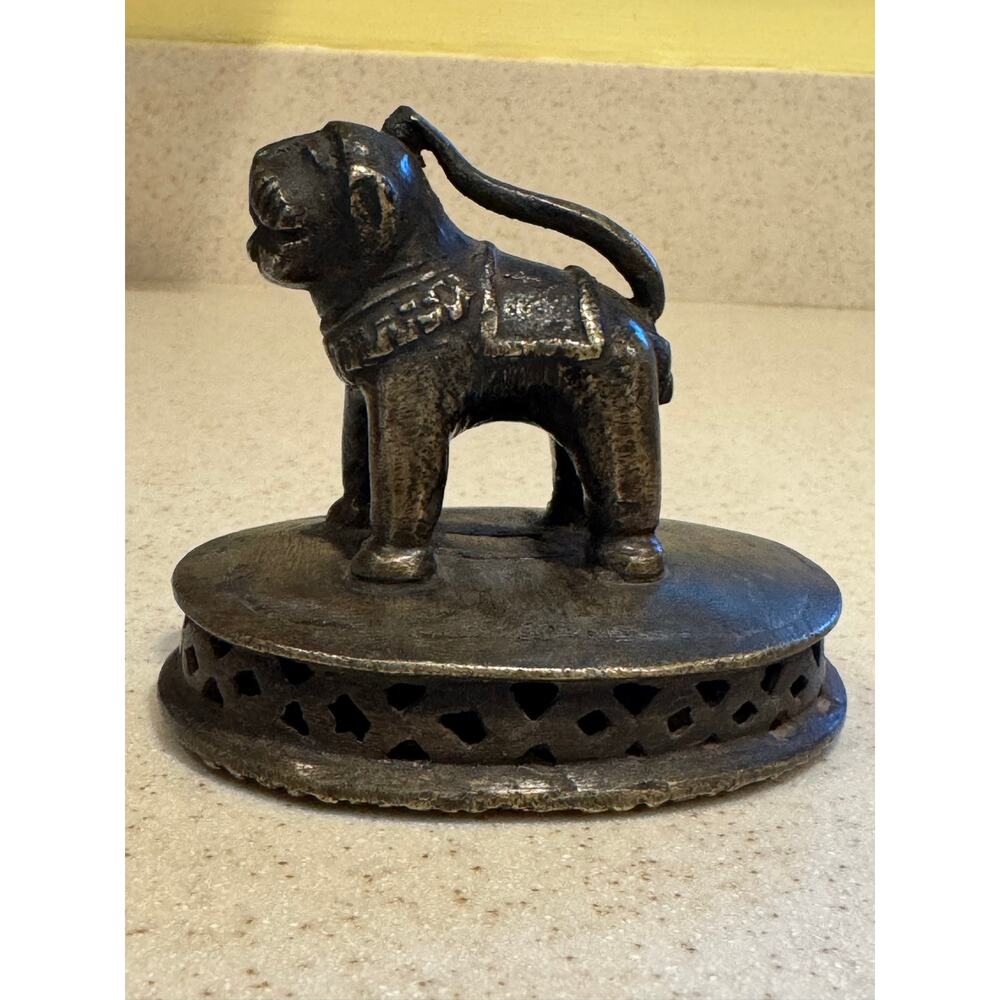 Vintage brass Indian foot scrubber with a fu dog handle
